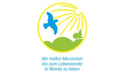 Ein blaues Vogel-Symbol fliegt vor einer Sonne über einer grünen Landschaft mit Bäumen; darunter steht der Text: "Wir helfen Menschen bis zum Lebensende in Würde zu leben."